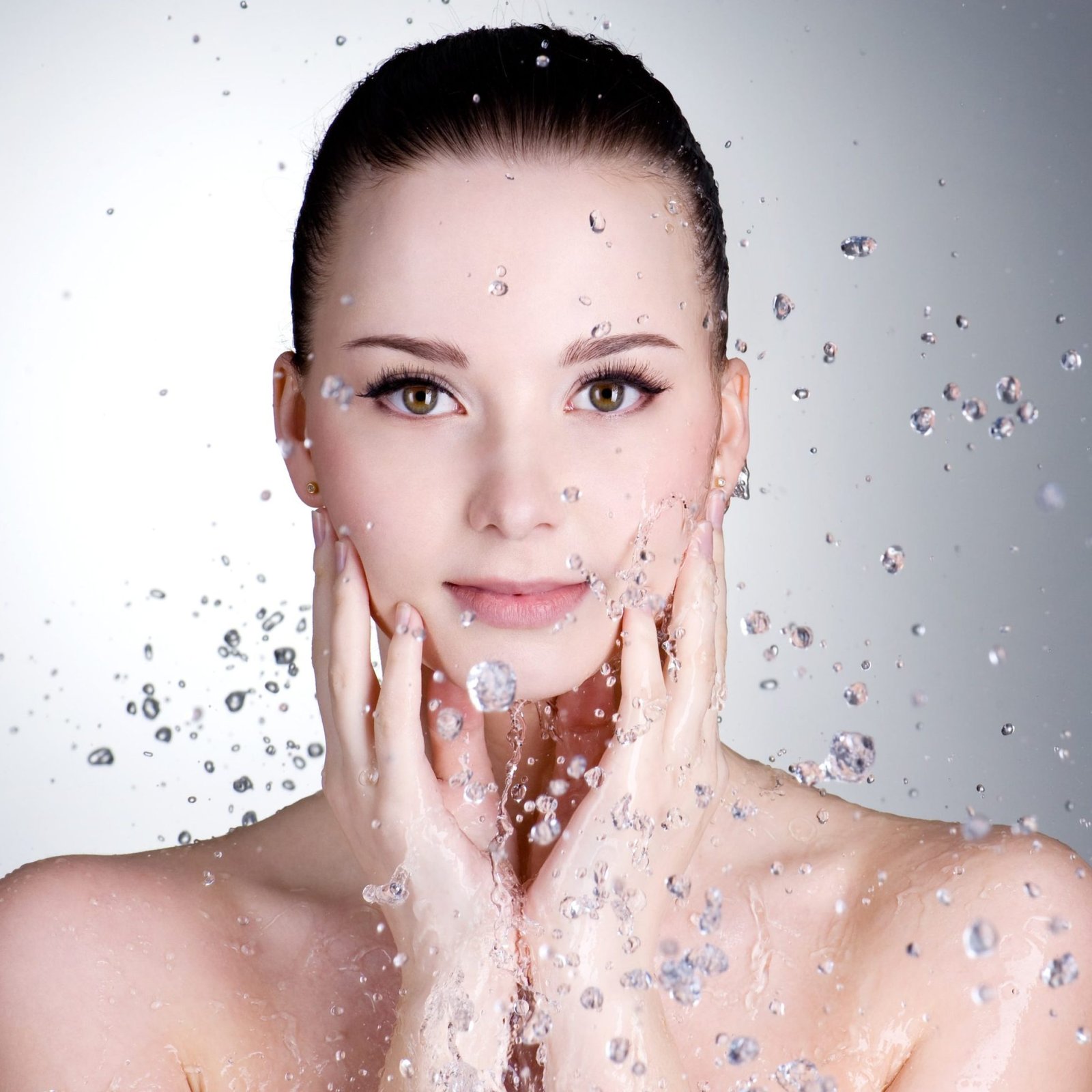 portrait-beautiful-young-woman-with-drops-water-around-her-face-min